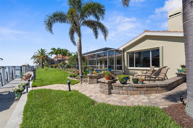 2160 Palm Tree Dr, Punta Gorda, FL 33950 - view of grassy yard with glass enclosure and a patio