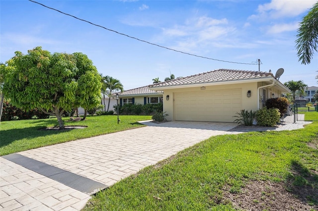 2160 Palm Tree Dr, Punta Gorda, FL 33950 - single story home with a garage, stucco siding, driveway, and a tile roof