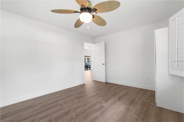 2160 Palm Tree Dr, Punta Gorda, FL 33950 - unfurnished room featuring wood finished floors and a ceiling fan