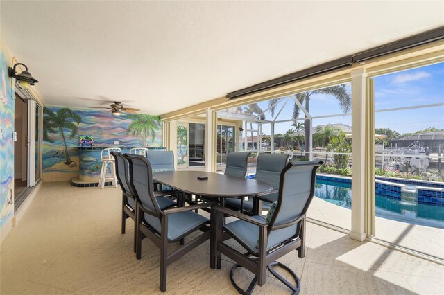 2160 Palm Tree Dr, Punta Gorda, FL 33950 - sunroom / solarium featuring outdoor dining area and ceiling fan