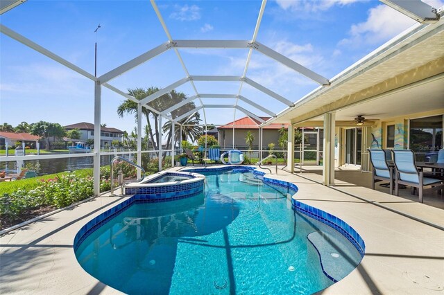 2160 Palm Tree Dr, Punta Gorda, FL 33950 - view of pool with a patio area, a ceiling fan, a pool with connected hot tub, a lanai, and outdoor dining space