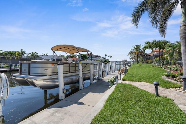 2160 Palm Tree Dr, Punta Gorda, FL 33950 - dock featuring boat lift and a yard