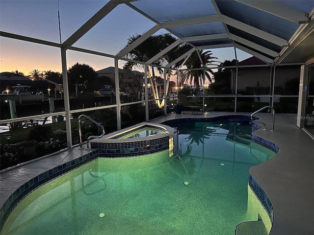 2160 Palm Tree Dr, Punta Gorda, FL 33950 - pool at dusk with a pool with connected hot tub, a patio area, and glass enclosure