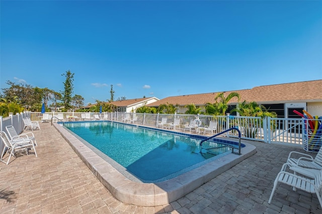 view of swimming pool with a patio