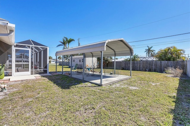 view of yard featuring a patio and a lanai