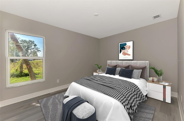 bedroom with dark wood-style floors, visible vents, and baseboards