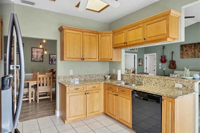 kitchen with a ceiling fan, dishwasher, freestanding refrigerator, a peninsula, and a sink