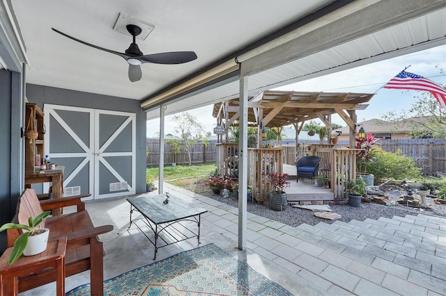 view of patio / terrace with a fenced backyard, a shed, and an outdoor structure