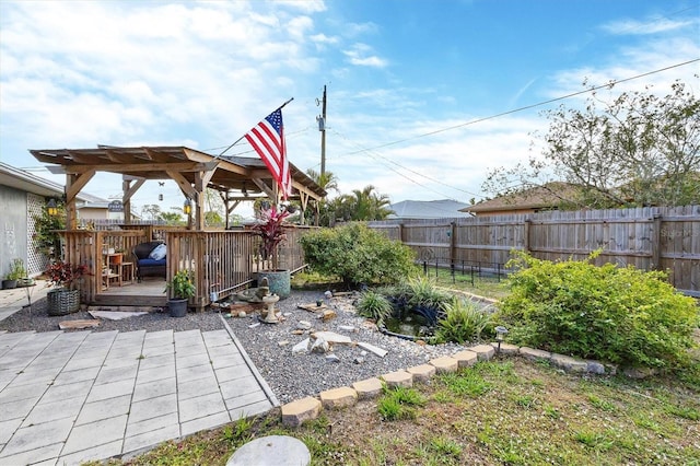 view of yard featuring a fenced backyard and a wooden deck