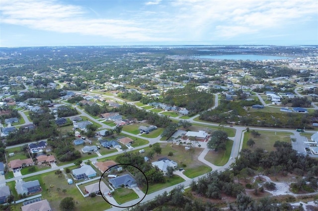 bird's eye view featuring a water view and a residential view