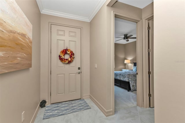 entrance foyer with crown molding, ceiling fan, and light tile patterned floors