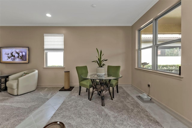 dining area featuring crown molding and light tile patterned floors