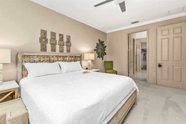 carpeted bedroom featuring crown molding and ceiling fan