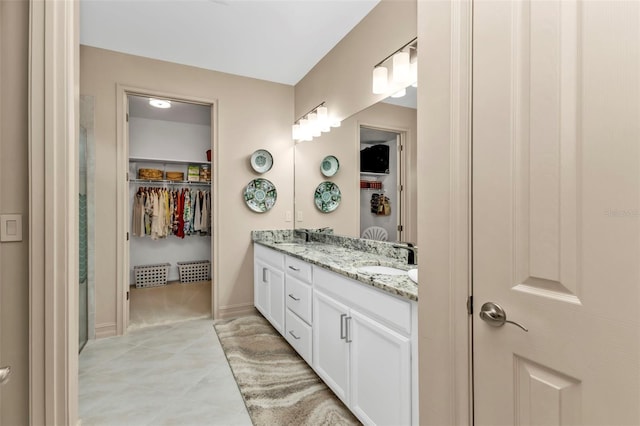 bathroom featuring tile patterned floors and vanity