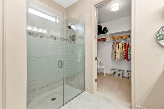 bathroom featuring walk in shower and tile patterned flooring