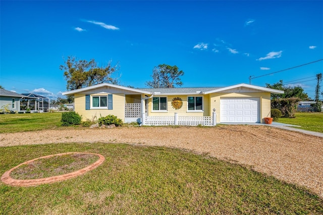 ranch-style house with a garage and a front yard