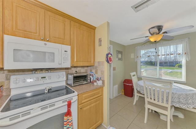 kitchen with tasteful backsplash, light brown cabinetry, white appliances, ceiling fan, and light tile patterned floors