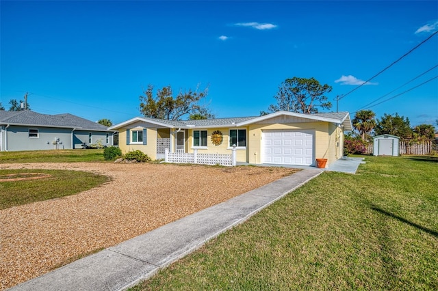 ranch-style home featuring a front lawn, a shed, and a garage