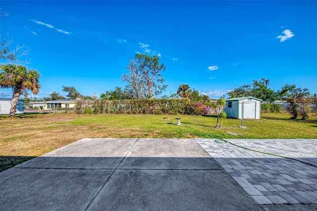 view of patio with a storage shed