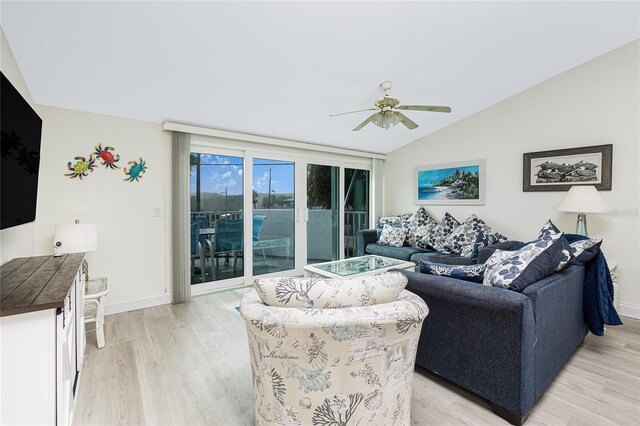2255 N Beach Rd Unit 13, Englewood, FL 34223 - living area with baseboards, a ceiling fan, vaulted ceiling, and light wood-type flooring