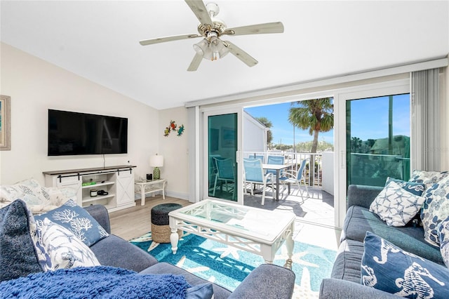 2255 N Beach Rd Unit 13, Englewood, FL 34223 - living area featuring light wood-type flooring, ceiling fan, baseboards, and vaulted ceiling
