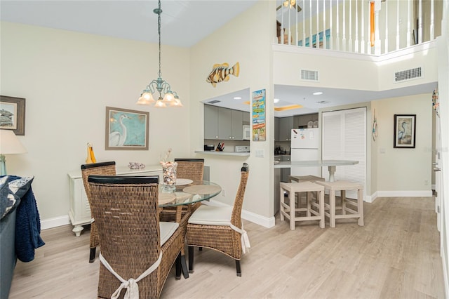 2255 N Beach Rd Unit 13, Englewood, FL 34223 - dining area featuring baseboards, visible vents, and light wood-style floors