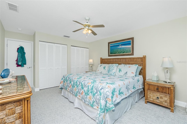 2255 N Beach Rd Unit 13, Englewood, FL 34223 - bedroom featuring baseboards, visible vents, two closets, and a ceiling fan