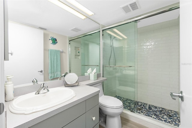 2255 N Beach Rd Unit 13, Englewood, FL 34223 - bathroom with toilet, visible vents, and a stall shower