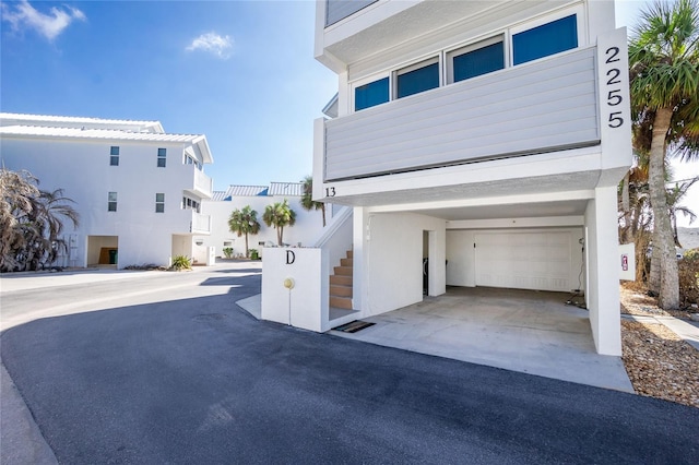2255 N Beach Rd Unit 13, Englewood, FL 34223 - view of front of property with concrete driveway and stucco siding