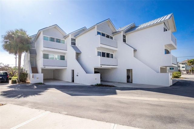2255 N Beach Rd Unit 13, Englewood, FL 34223 - exterior space featuring metal roof and stucco siding
