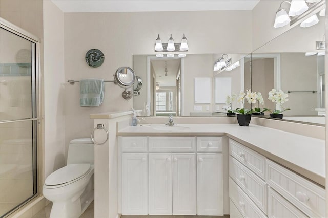 7430 Palm Island Dr Unit 3813, Placida, FL 33946 - bathroom with vanity, a shower with shower door, and toilet