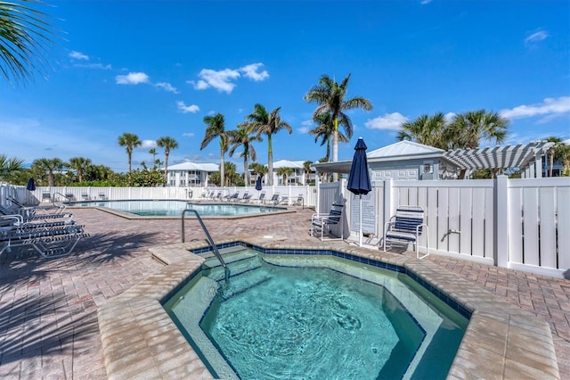 7430 Palm Island Dr Unit 3813, Placida, FL 33946 - view of pool with a patio, a pergola, and a community hot tub