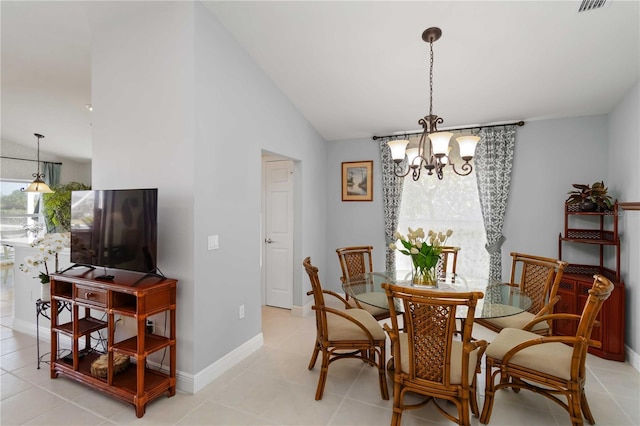 dining space featuring visible vents, baseboards, lofted ceiling, light tile patterned flooring, and a chandelier