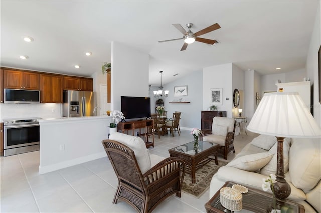 living room with ceiling fan with notable chandelier, recessed lighting, light tile patterned floors, baseboards, and vaulted ceiling