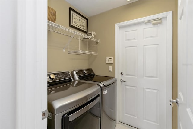 washroom featuring laundry area and independent washer and dryer