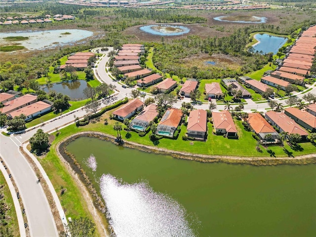 aerial view featuring a residential view and a water view