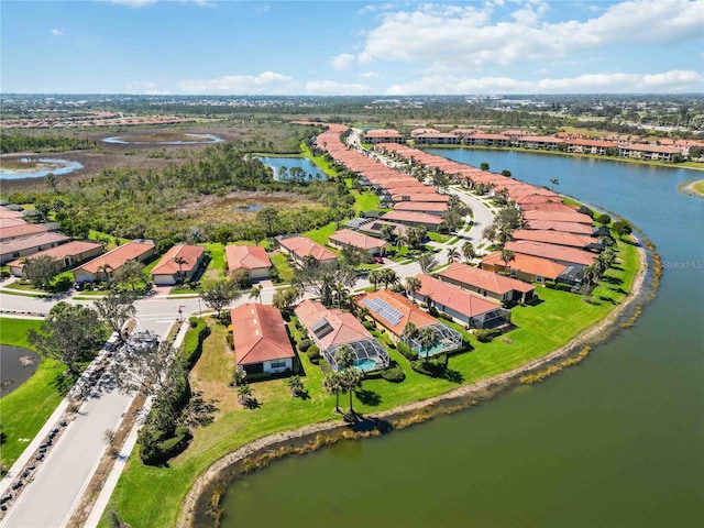 aerial view with a residential view and a water view