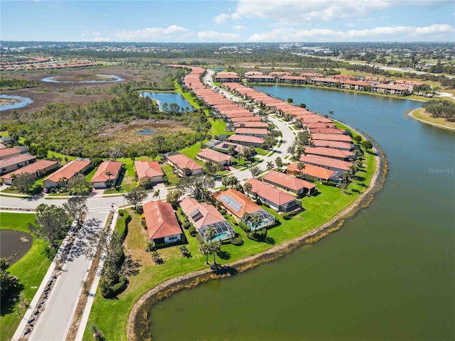 bird's eye view with a residential view and a water view