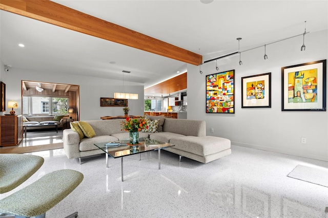 living room featuring beamed ceiling