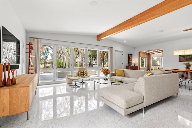 living room with plenty of natural light and vaulted ceiling with beams