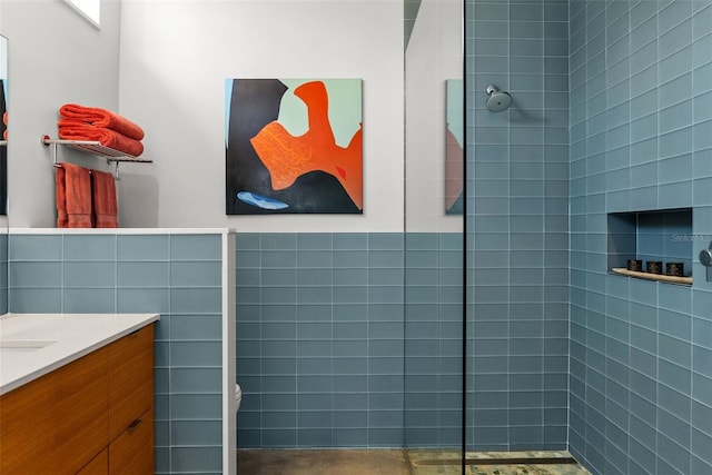 bathroom with tile walls and vanity