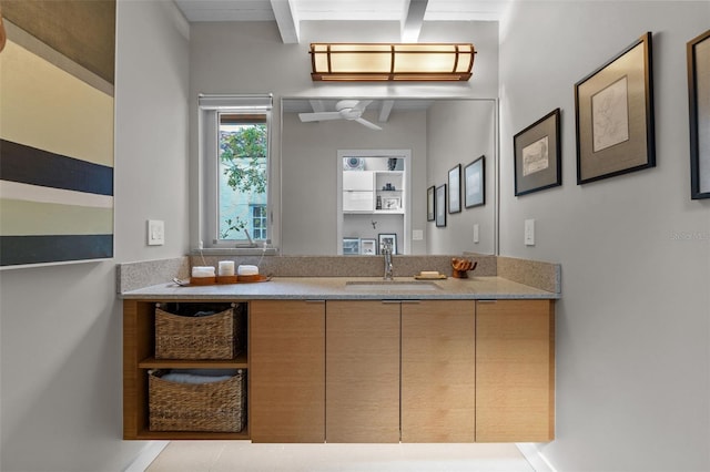 bathroom featuring vanity and beam ceiling