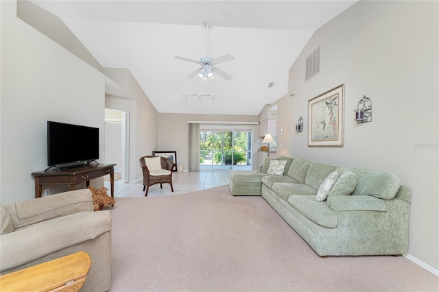 living area featuring light tile patterned floors, light colored carpet, a ceiling fan, baseboards, and visible vents