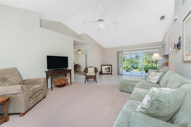 living room featuring ceiling fan, light tile patterned flooring, light carpet, visible vents, and rail lighting