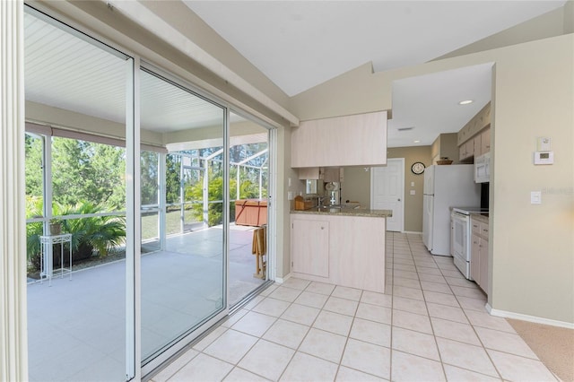 kitchen with light tile patterned floors, white appliances, baseboards, lofted ceiling, and light stone counters