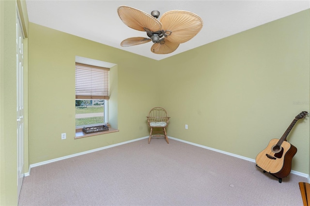 empty room featuring carpet floors, baseboards, and a ceiling fan