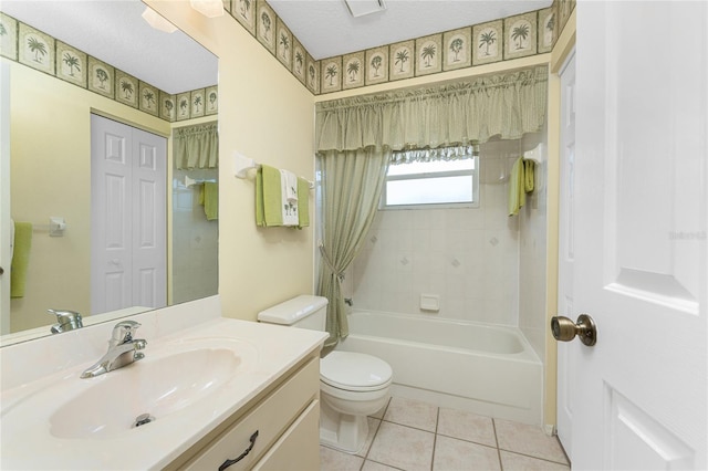 full bath featuring a textured ceiling, toilet, vanity, tile patterned floors, and shower / bath combination with curtain