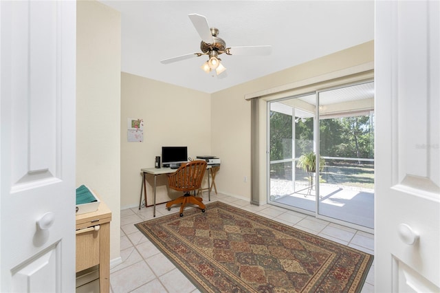 home office with light tile patterned floors, ceiling fan, and baseboards