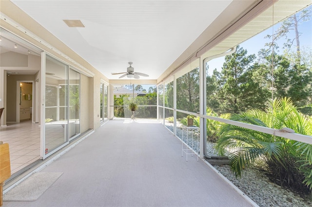 sunroom featuring ceiling fan