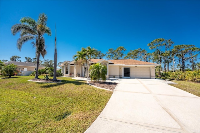 view of front of house featuring a garage, concrete driveway, and a front yard